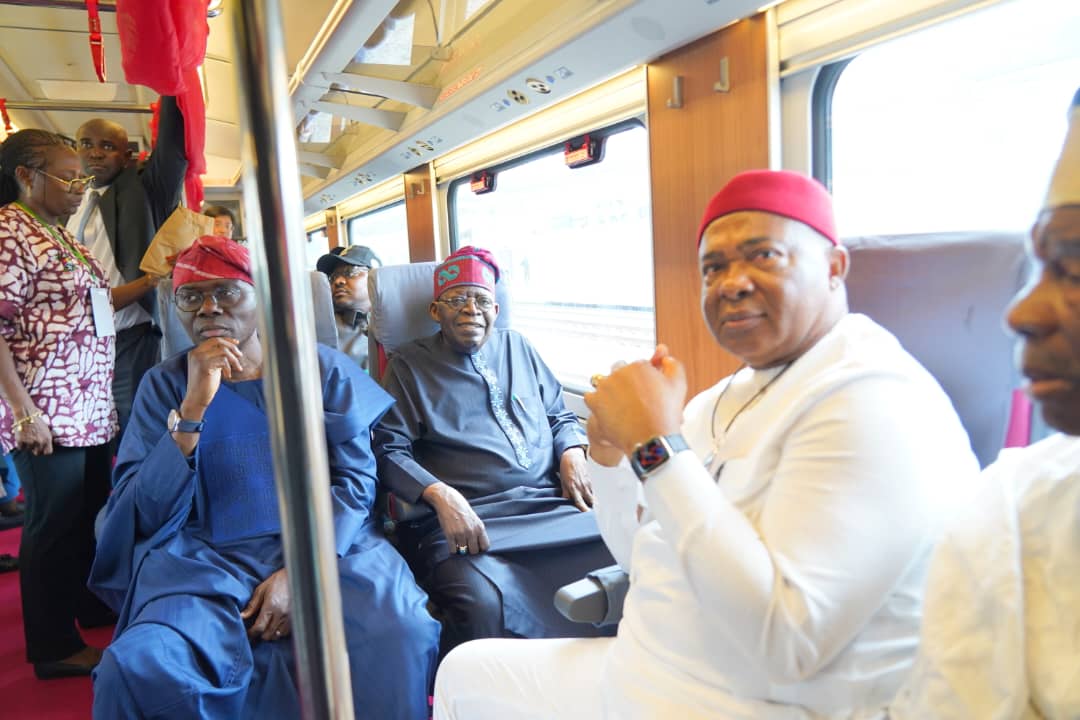 R- L: Governor Hope Uzodimma of Imo State, President Bola Ahmed Tinubu and Governor Babajide Sanwo-Olu enjoying a deserved train ride after the commissioning of the Lagos Red Line project by President Tinubu Thursday in Lagos